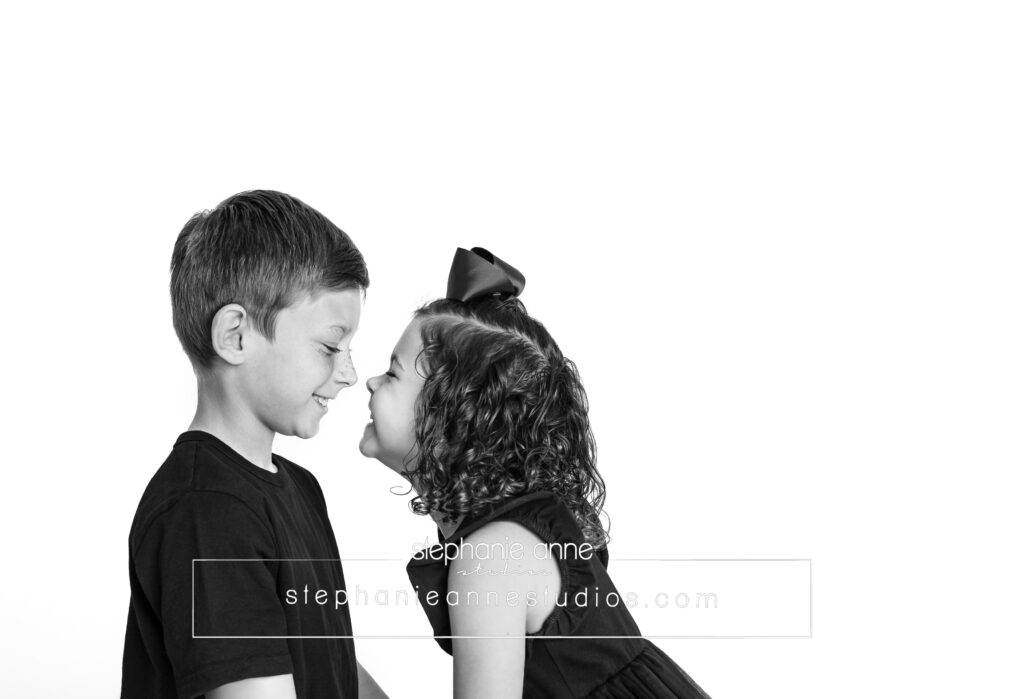 black and white child portrait siblings